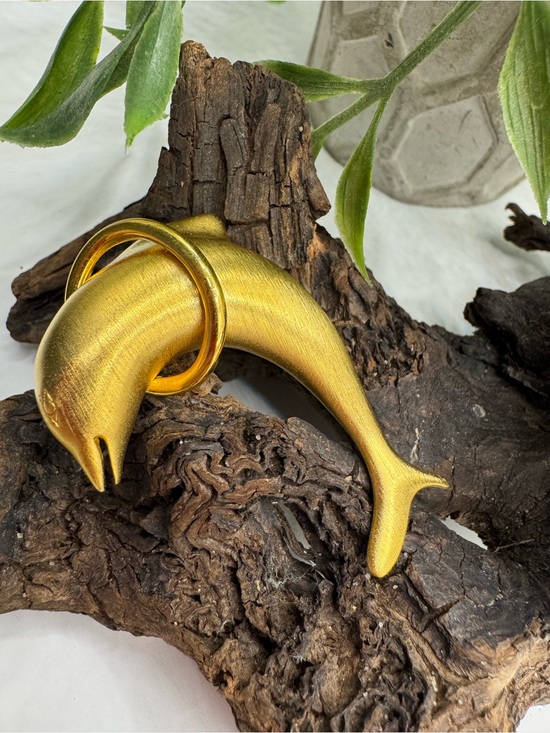Jewelry - Vintage dolphin brooch, EUC. Satin gold tone finish, jumping thru polished hoop.